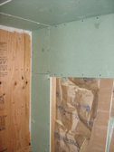patching holes from electrical electrican MEP work fireproofing foam taping and spackling shower and tub caulk recycling construction material recycling job site wastes GREEN building